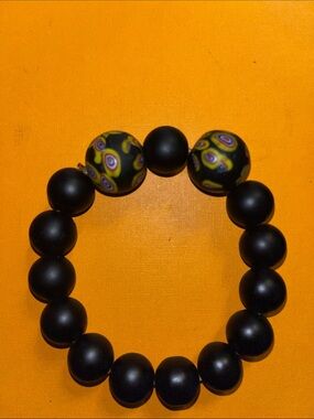 Black Beaded Stretch Bracelet with Yellow Pattern Accent Beads